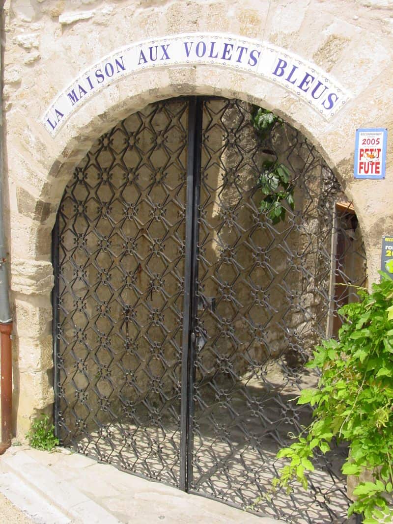 This gate swings inward behind the arch.