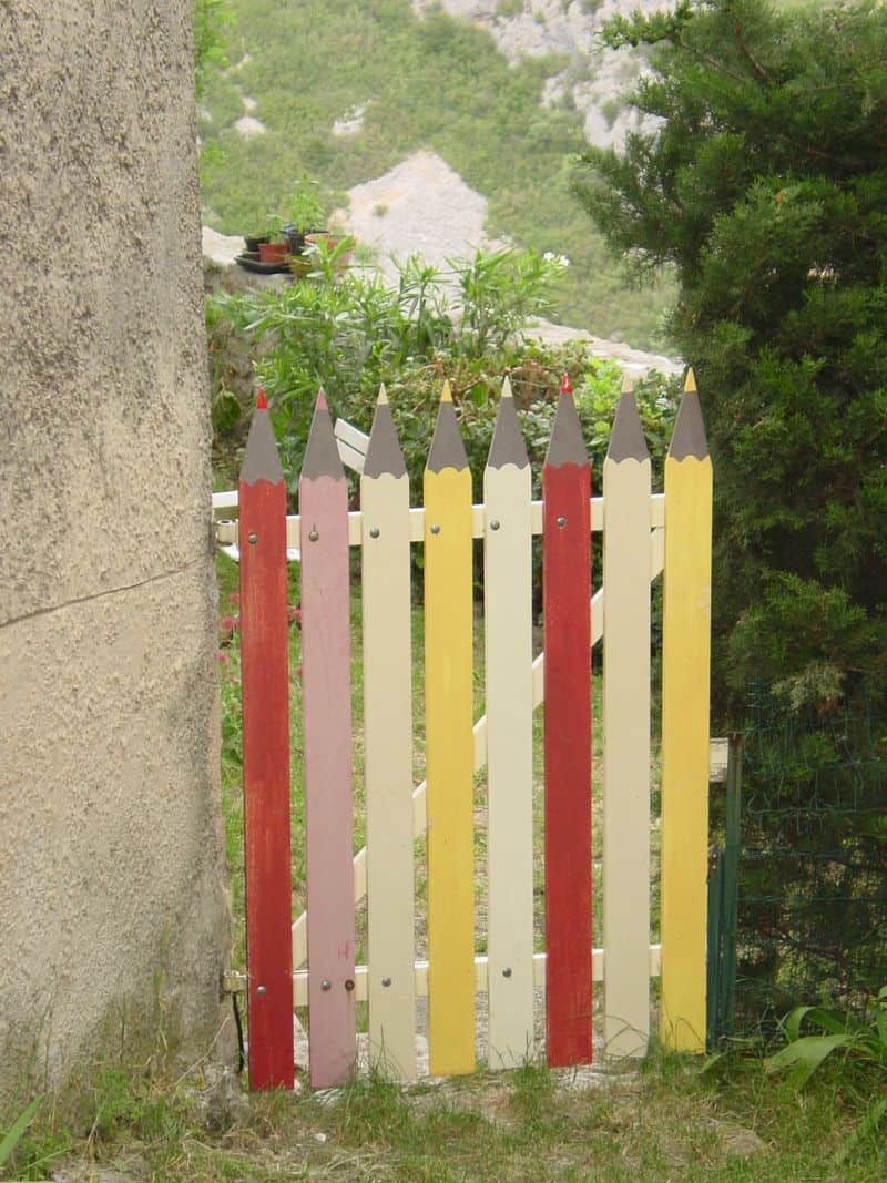 This variation of a white picket gate would work in many small gardens.