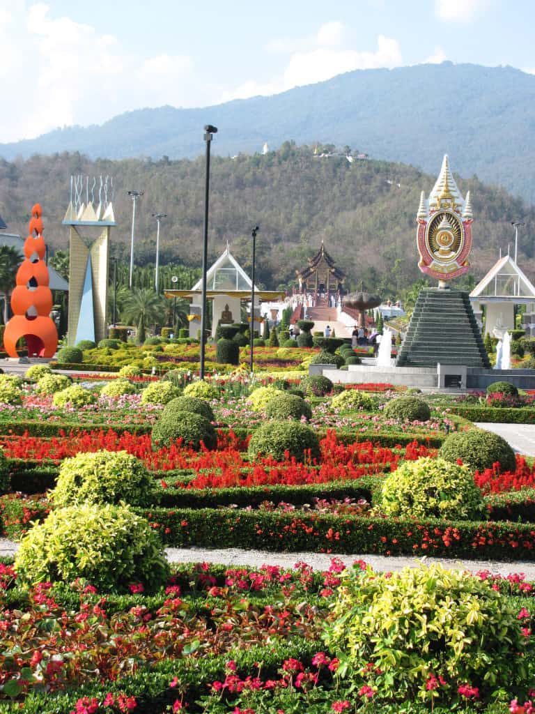 In this view of the main garden the Royal Pavilion is in the mid-ground and Doi Kham is the mountain in the background.